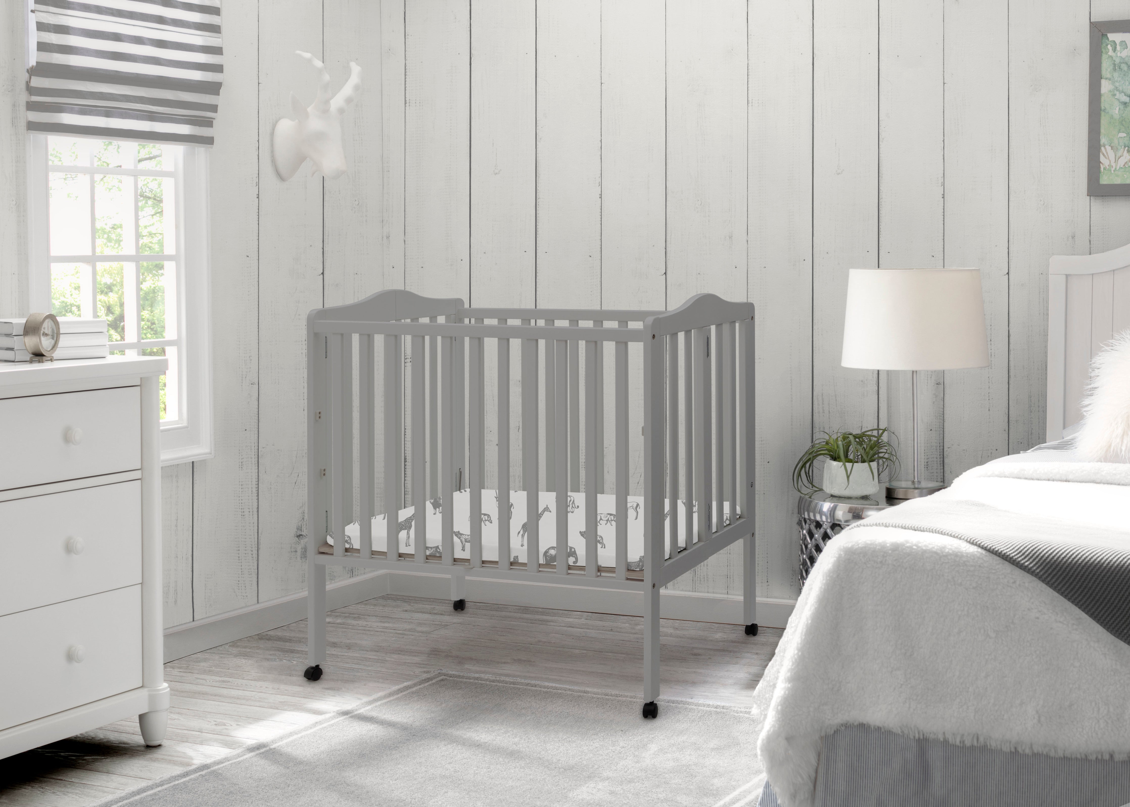 Delta Children Folding Portable Mini Baby Crib with 1.5-inch Mattress